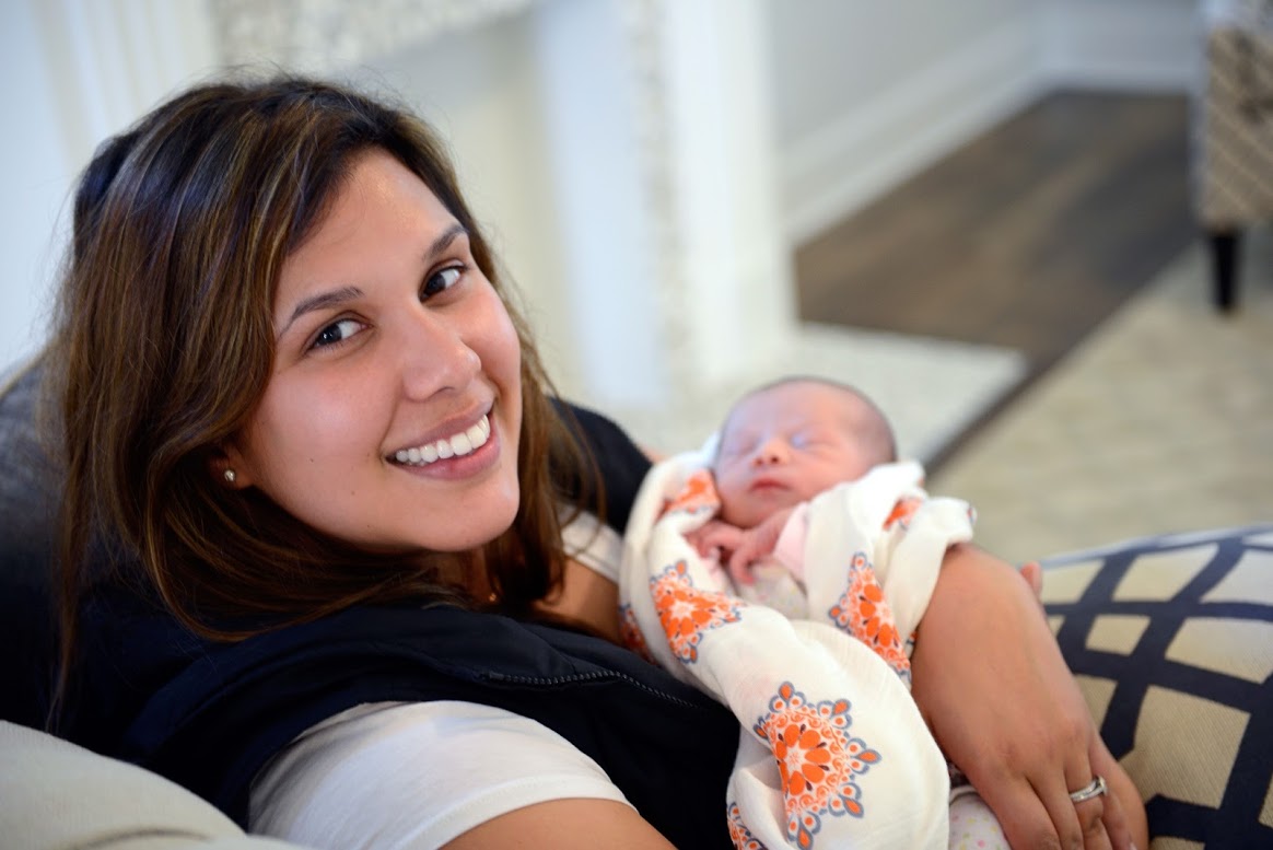 Dr. Katriny Ikbal holding a baby