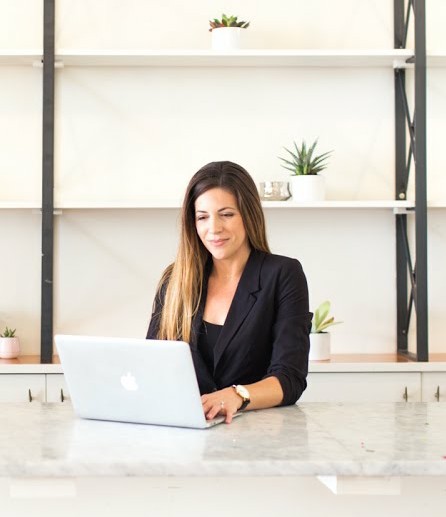 Dr Katie Keller using laptop